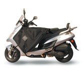 Coprigambe Termoscud®, un coprigambe impermeabile con fodera termica. Su scooter. Di TUCANO URBANO.